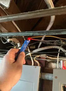 Active knob and tube wiring found during a home inspection in Akron.