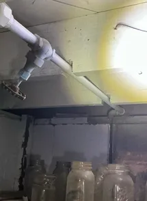 Improper cuts in basement joists found during a home inspection in Cambridge.