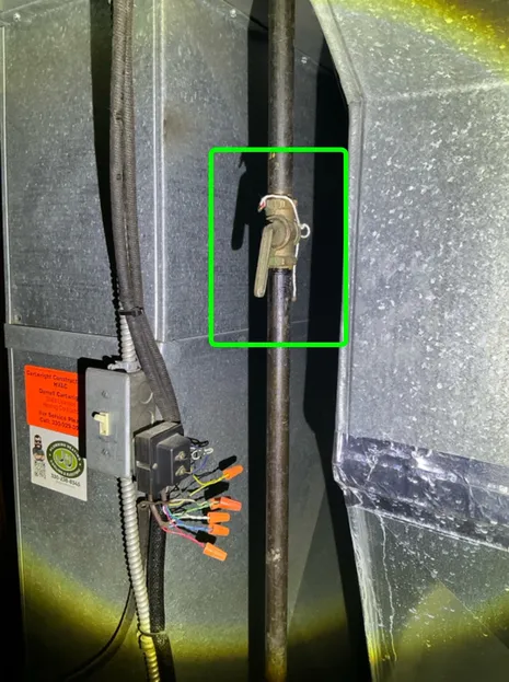An antiquated gas valve with a very noticeable former red tag from the gas company found during a home inspection in Copley.