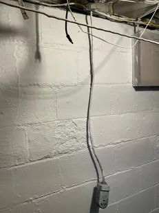 Improperly installed high voltage receptacle found during a home inspection in East Cleveland.