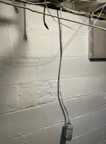 Improperly installed high voltage receptacle found during a home inspection in Green.