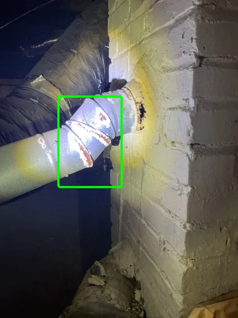 A rusty hvac vent found during a home inspection in Lyndhurst.