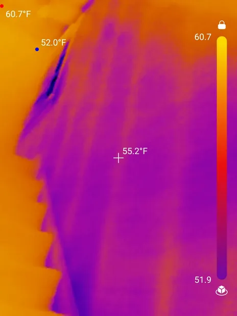 Inconsistent insulation on the wall of the stairwell found during a home inspection in Maple Heights.