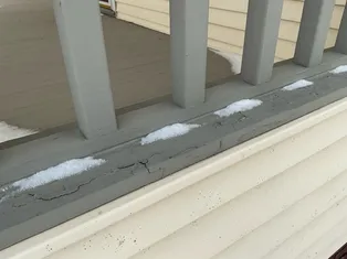 deteriorated paint and wood on deck found during a home inspection in Parma