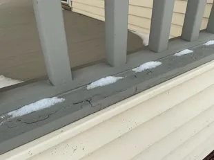 deteriorated paint and wood on deck found during a home inspection in Richmond Heights
