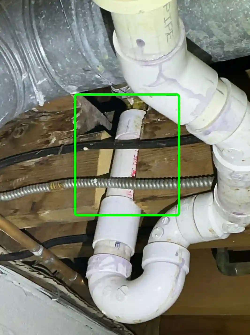 The home inspection highlights Pipe going all the way through a basement joist in Barberton found during the home inspection.