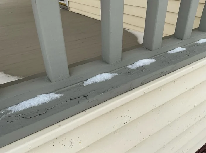 A detailed review revealed Deteriorated paint and wood on deck in Brunswick observed during a home inspection.