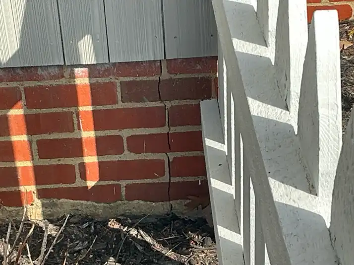 The home inspection highlights Large foundation crack in Copley found during the home inspection.