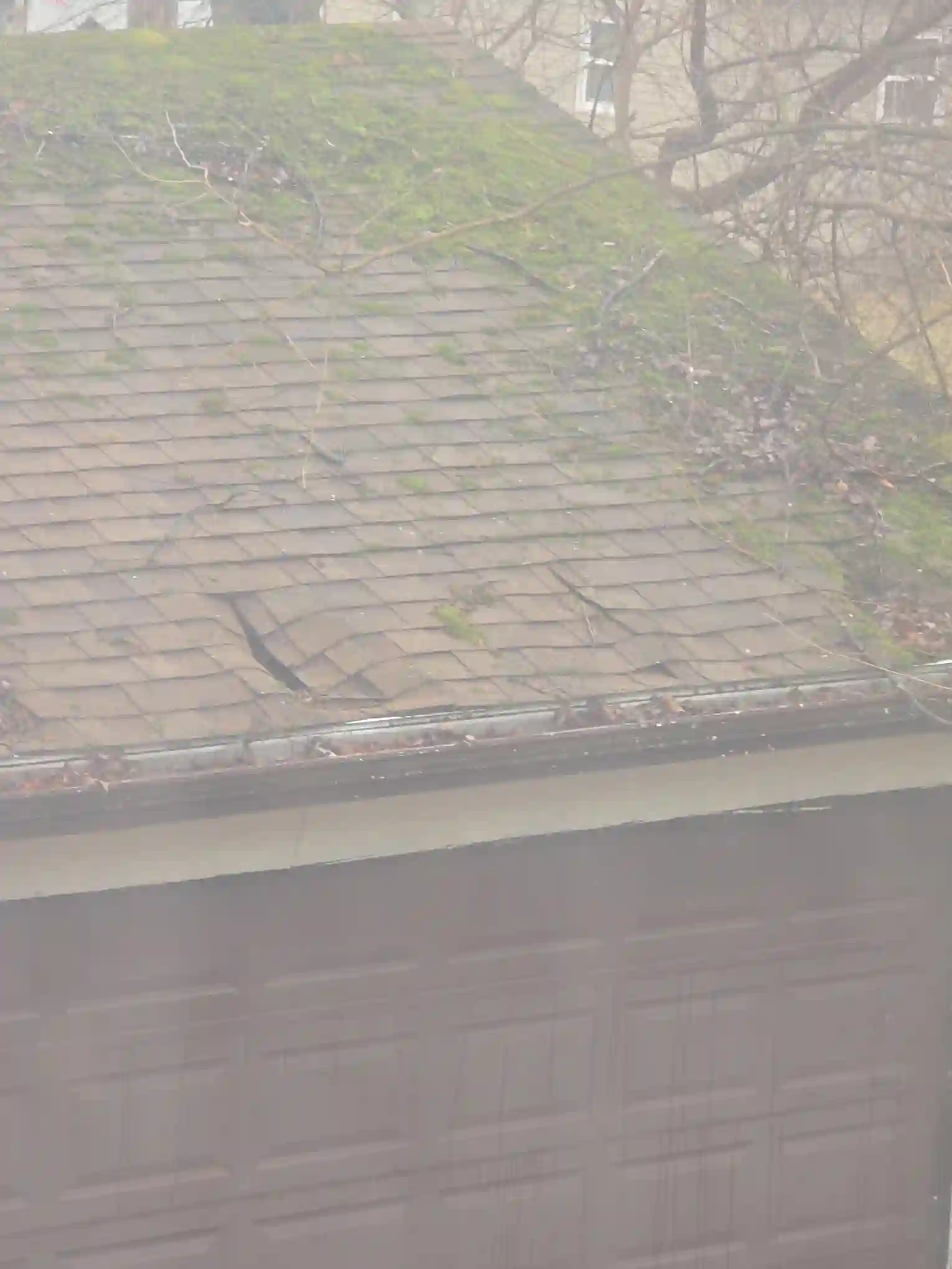 A detailed review revealed Severely damaged garage roof in Richmond Heights observed during a home inspection.