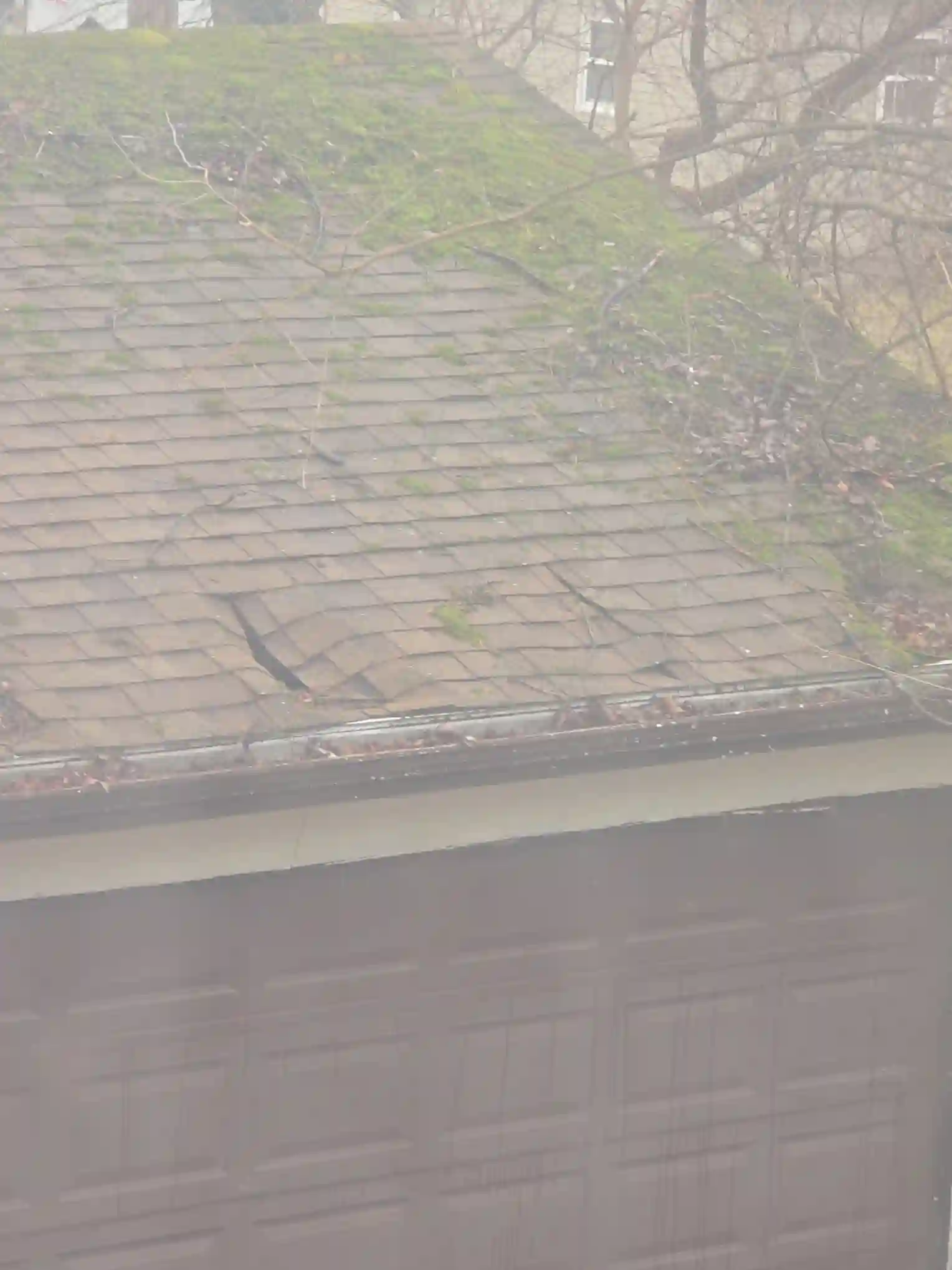 The home inspector identified Severely damaged garage roof in Rocky River during the home inspection.