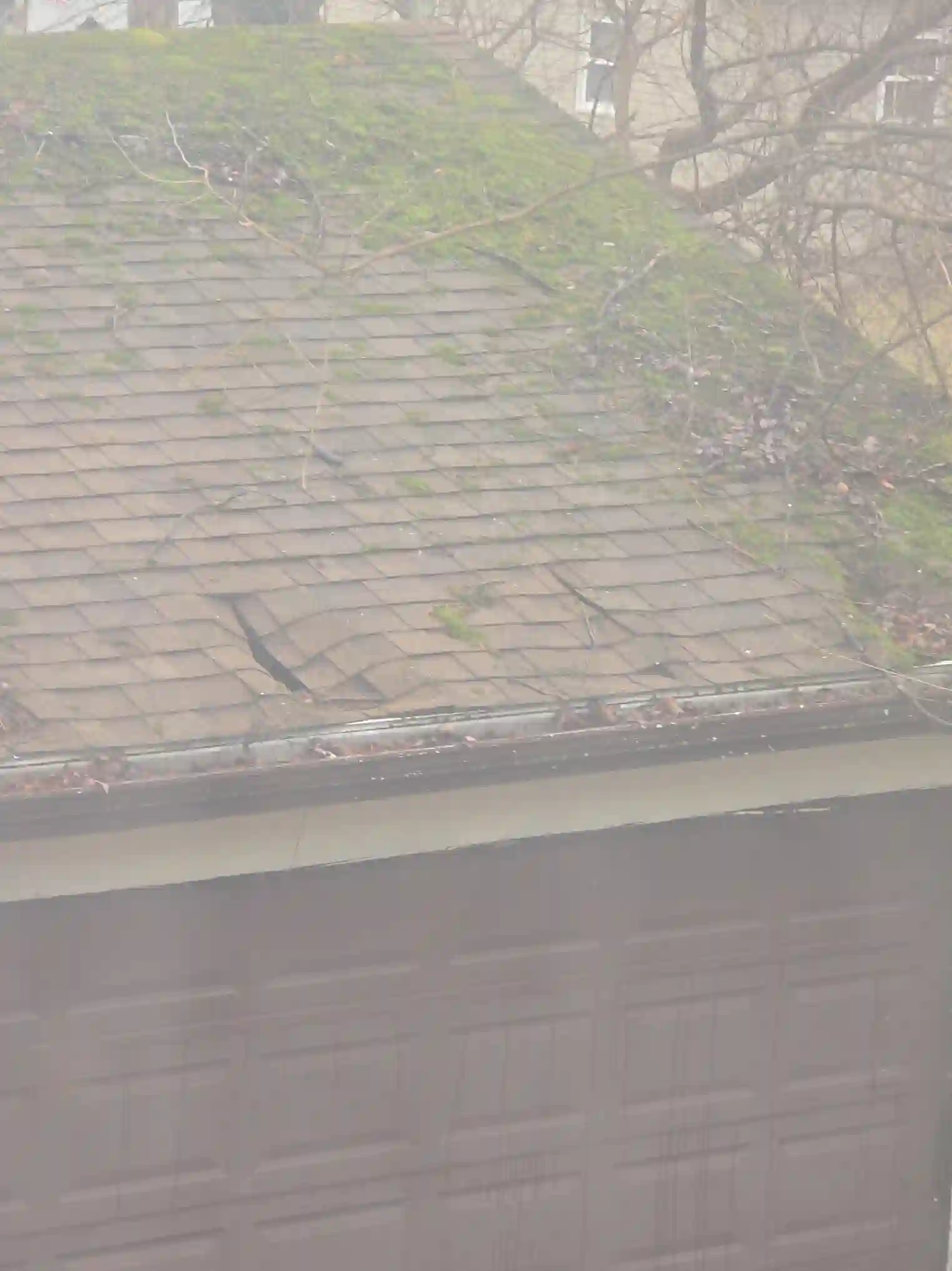 Severely damaged garage roof in Shaker Heights was observed during a home inspection.