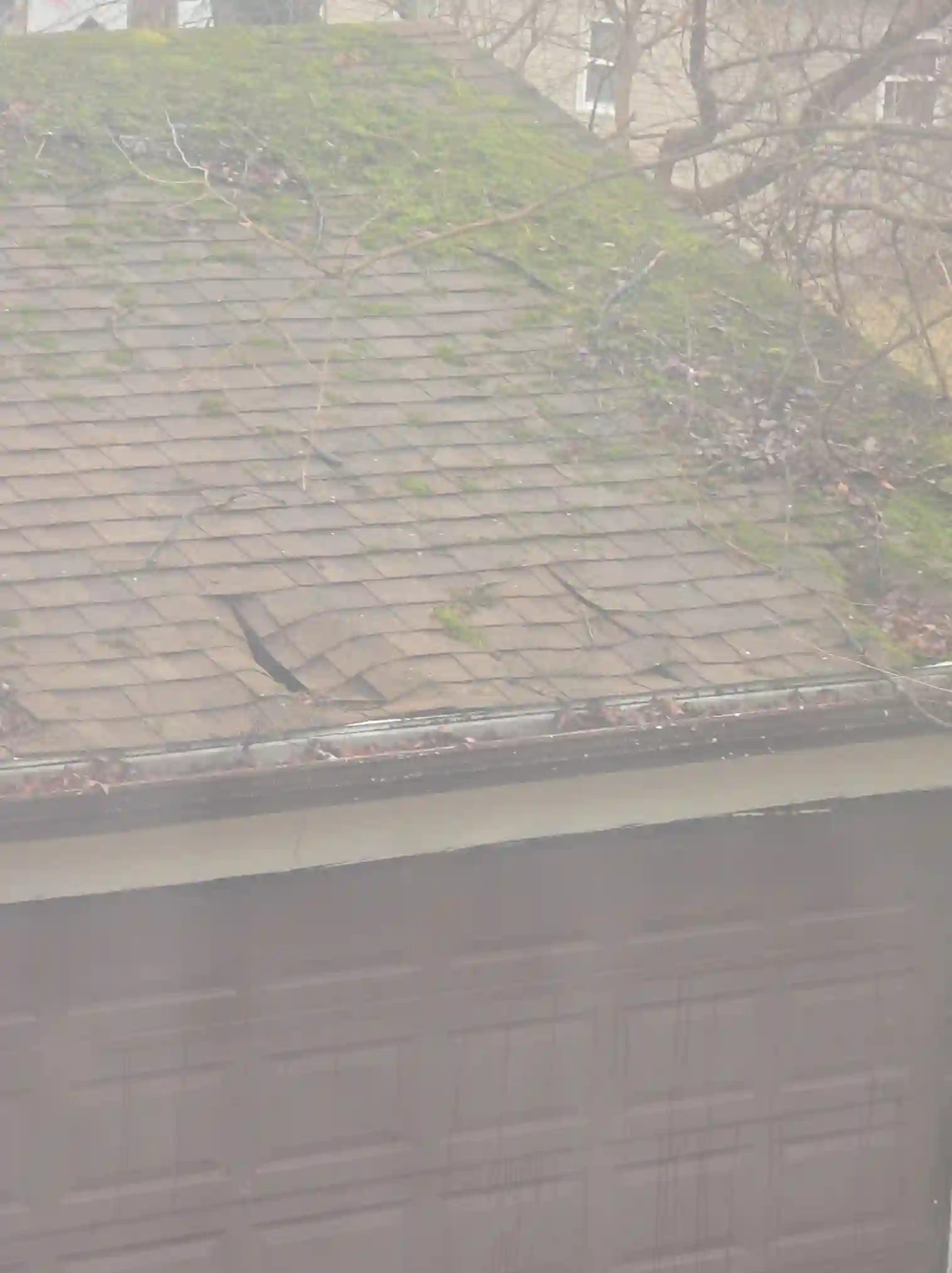 The home inspection highlights Severely damaged garage roof in Stow found during the home inspection.