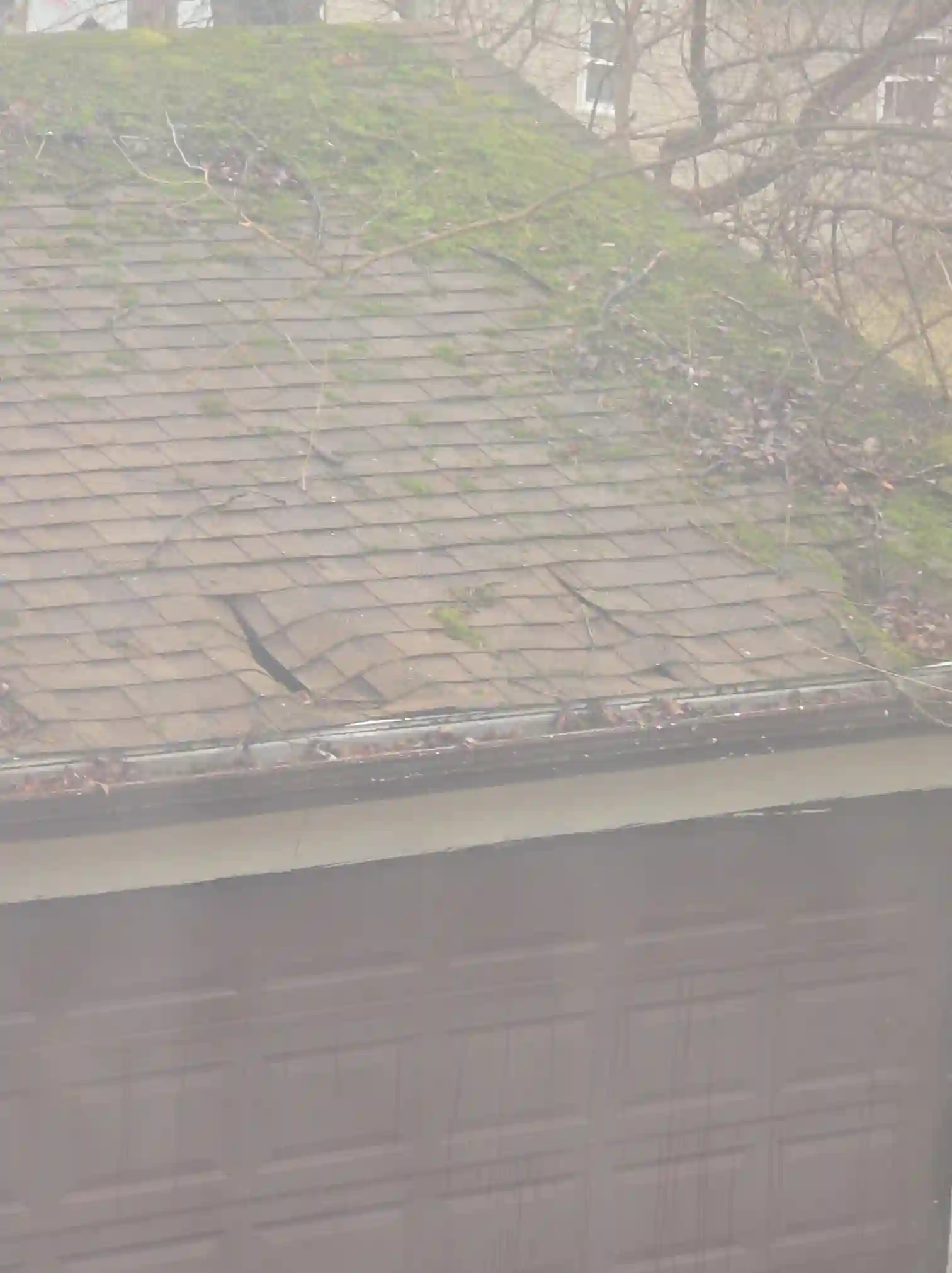 The home inspector identified Severely damaged garage roof in Struthers during the home inspection.