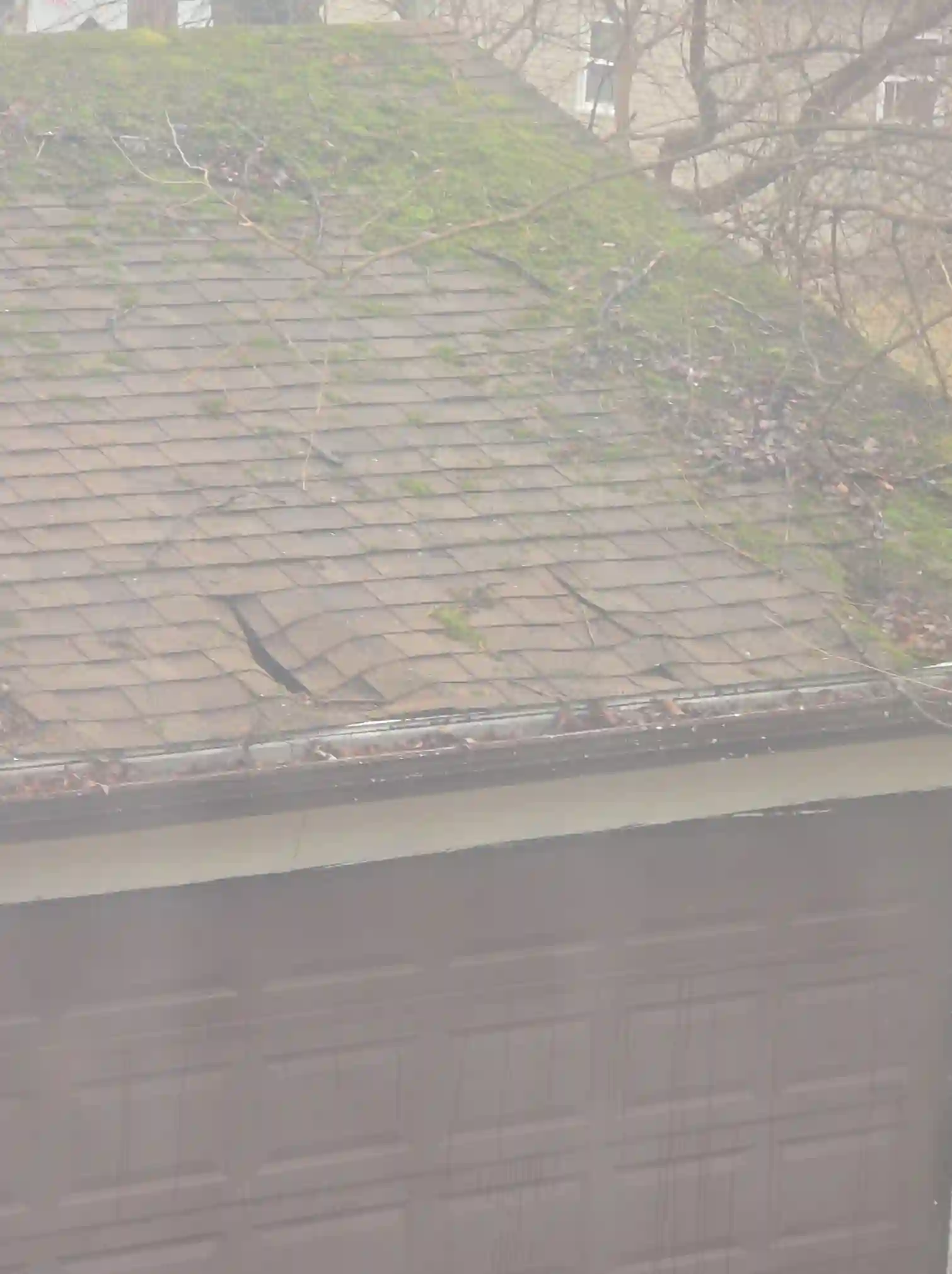 Found during our home inspection: Severely damaged garage roof in Tallmadge.