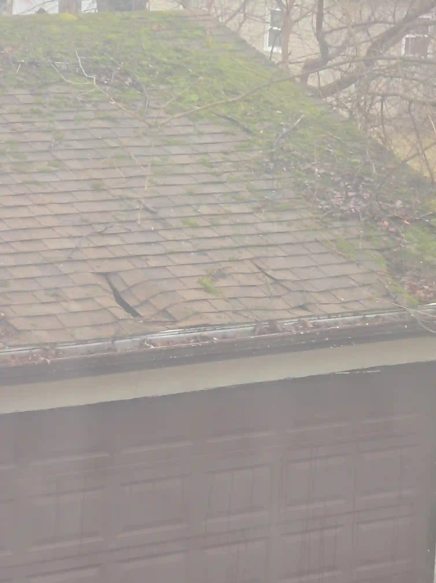 Severely damaged garage roof in Twinsburg was observed during a home inspection.