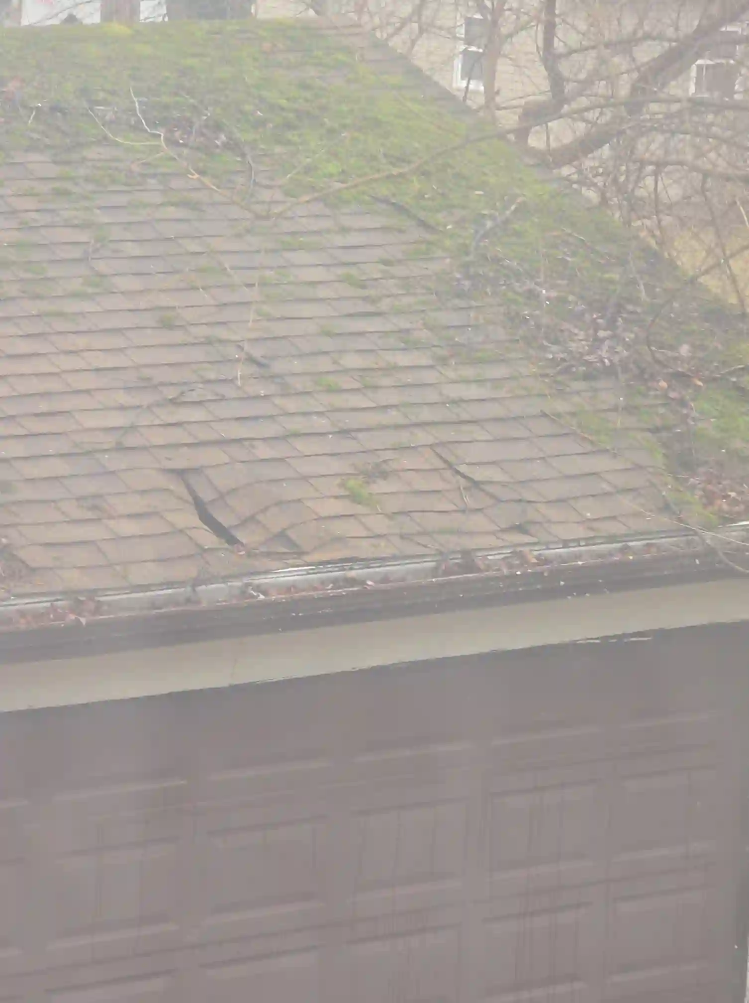 Evidence of Severely damaged garage roof in University Heights was observed during the home inspection.