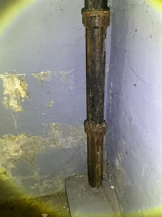 The home inspector identified Severely corroded drain pipe and water stains on the basement wall in Wickliffe during the home inspection.