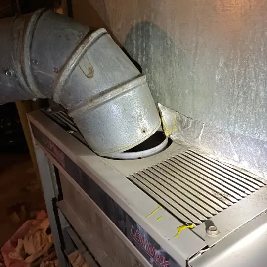 Rusted and disconnected furnace ventilation pipe in Solon. The occupants were unaware that they were being exposed to high levels of carbon monoxide.