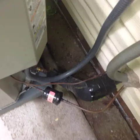 Missing insulation on AC coolant line in Cuyahoga Falls